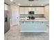 Kitchen featuring white cabinets, granite countertops and stainless steel appliances at 291 Whistling Duck Trl, St Cloud, FL 34771