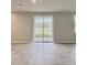 Living room with sliding glass doors providing outdoor views and natural light at 291 Whistling Duck Trl, St Cloud, FL 34771
