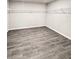 Spacious walk-in closet with durable wood-look floors and custom shelving at 291 Whistling Duck Trl, St Cloud, FL 34771