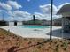 Community pool featuring a sun bathing deck and lounge seating amid well manicured landscaping at 7358 Sw 76Th Ter, Ocala, FL 34481