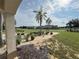 Great golf course view from covered patio with columns at 7465 Excitement Dr, Reunion, FL 34747