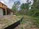 View of the undeveloped backyard with trees at 405 Long And Winding Rd, Howey In The Hills, FL 34737