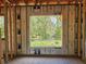 Framed window view with construction, showcasing the backyard and nature views at 405 Long And Winding Rd, Howey In The Hills, FL 34737