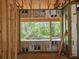 Framed window view with construction, showcasing the backyard and nature views at 405 Long And Winding Rd, Howey In The Hills, FL 34737