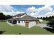 Rendering of a two-story home with a rear garage and porch at 405 Long And Winding Rd, Howey In The Hills, FL 34737