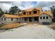 New construction home featuring a two-story layout, block construction and a covered porch at 405 Long And Winding Rd, Howey In The Hills, FL 34737