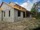 New home with block construction and a covered porch at 405 Long And Winding Rd, Howey In The Hills, FL 34737