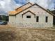 Image of new construction home showcasing its block construction and architectural style at 405 Long And Winding Rd, Howey In The Hills, FL 34737