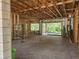 Under-construction garage with wooden framing and concrete floor, highlighting the potential for a functional space at 405 Long And Winding Rd, Howey In The Hills, FL 34737