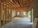 Spacious garage under construction, featuring block walls, wooden beams, and concrete floors, ready for customization at 405 Long And Winding Rd, Howey In The Hills, FL 34737