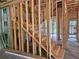 Framed staircase under construction, showcasing the potential for a welcoming and functional transition between floors at 405 Long And Winding Rd, Howey In The Hills, FL 34737