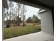 View of backyard with new landscaping and pond at 300 Barebow Ln, Ormond Beach, FL 32174