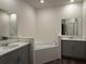 Bathroom with soaking tub and double vanity at 300 Barebow Ln, Ormond Beach, FL 32174