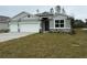 Two-car garage and neutral colored exterior at 300 Barebow Ln, Ormond Beach, FL 32174