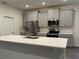 Modern kitchen featuring stainless steel appliances and ample cabinetry at 300 Barebow Ln, Ormond Beach, FL 32174