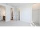 Bright bedroom with carpet floors and walk-in closet next to bathroom and staircase entrances at 2110 Whitney Marsh Aly, Orlando, FL 32804