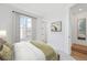 Comfortable bedroom with large window and view of the outdoors at 2110 Whitney Marsh Aly, Orlando, FL 32804