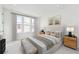 Serene bedroom with neutral tones, plush bedding, and large windows for ample natural light at 2110 Whitney Marsh Aly, Orlando, FL 32804