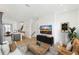 Inviting living room with modern furniture, hardwood floors, and a large-screen TV at 2110 Whitney Marsh Aly, Orlando, FL 32804