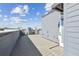 Spacious roof deck with gray decking and city views from modern building at 2110 Whitney Marsh Aly, Orlando, FL 32804
