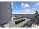 Spacious rooftop deck with outdoor dining and lounge area, perfect for entertaining with a great view at 2110 Whitney Marsh Aly, Orlando, FL 32804