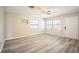 The home features an extra living room with windows for natural light, light gray wood-look flooring, and neutral paint at 507 Francis Blvd, Lakeland, FL 33801