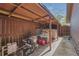Backyard storage area for pool or yard equipment with wood support structure at 51 Oakleigh Ln, Maitland, FL 32751