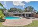 Beautiful backyard featuring a large swimming pool with brick paver patio, perfect for outdoor living and entertaining at 51 Oakleigh Ln, Maitland, FL 32751