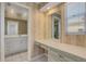 Bathroom with a vanity, a decorative mirror, a makeup table, and bright natural light at 51 Oakleigh Ln, Maitland, FL 32751