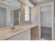 Bathroom with a vanity with a large mirror and a separate doorway entrance at 51 Oakleigh Ln, Maitland, FL 32751