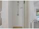 Bathroom shower with white subway tiles and a glass door with a bronze faucet at 51 Oakleigh Ln, Maitland, FL 32751