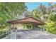 Photo showing a wooden covered bridge/carport at 51 Oakleigh Ln, Maitland, FL 32751