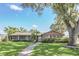 Inviting single-story home with a manicured lawn, brick pathway, and charming curb appeal at 51 Oakleigh Ln, Maitland, FL 32751