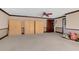 Open living area with wall of built-in storage and an accent wall at 51 Oakleigh Ln, Maitland, FL 32751
