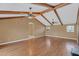 Bright, open-concept living area with vaulted ceilings and wood beams, showcasing hardwood floors, and ample space at 51 Oakleigh Ln, Maitland, FL 32751