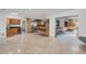 Open concept living space with breakfast bar, stainless refrigerator, and wine storage at 51 Oakleigh Ln, Maitland, FL 32751