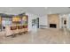 Open living area boasts a fireplace, breakfast bar, and seamless indoor-outdoor flow at 51 Oakleigh Ln, Maitland, FL 32751