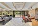 Bright sunroom with a vaulted ceiling, ceiling fans, and a view of the backyard pool at 51 Oakleigh Ln, Maitland, FL 32751