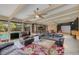 Sunroom features a comfortable seating area with direct access to the backyard pool at 51 Oakleigh Ln, Maitland, FL 32751