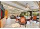 The airy sunroom includes beamed ceilings and backyard views of the pool and landscaping at 51 Oakleigh Ln, Maitland, FL 32751