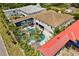 Bird's-eye view of the expansive home showcasing the beautiful outdoor pool area and landscaping at 1021 Fantasy Dr, Davenport, FL 33896