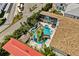 Aerial view of the backyard pool area with rock features, landscaping, and outdoor amenities at 1021 Fantasy Dr, Davenport, FL 33896
