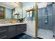 Elegant bathroom showcasing double vanity sinks with modern fixtures and a luxurious tiled shower at 1021 Fantasy Dr, Davenport, FL 33896