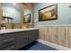 Inviting bathroom with dual sinks, mosaic backsplash, and an beachy decor at 1021 Fantasy Dr, Davenport, FL 33896
