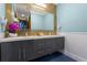 Elegant bathroom boasting a dual vanity with a mosaic tile backsplash, and a soft blue paint scheme at 1021 Fantasy Dr, Davenport, FL 33896