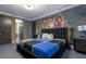 A stylish bedroom showcases a modern bed, unique wall art, and contemporary decor at 1021 Fantasy Dr, Davenport, FL 33896