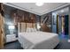 Unique bedroom with dark and moody textures, creative murals, and designer furnishings at 1021 Fantasy Dr, Davenport, FL 33896