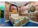 This bedroom features a custom painted wall mural, ornate headboard and footboard, and blue flooring at 1021 Fantasy Dr, Davenport, FL 33896