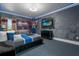 A whimsical bedroom features a custom-built Transformer, unique wall treatments, and a modern ceiling fan at 1021 Fantasy Dr, Davenport, FL 33896