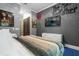 This contemporary bedroom features modern decor, a comfortable bed, and ample natural light at 1021 Fantasy Dr, Davenport, FL 33896